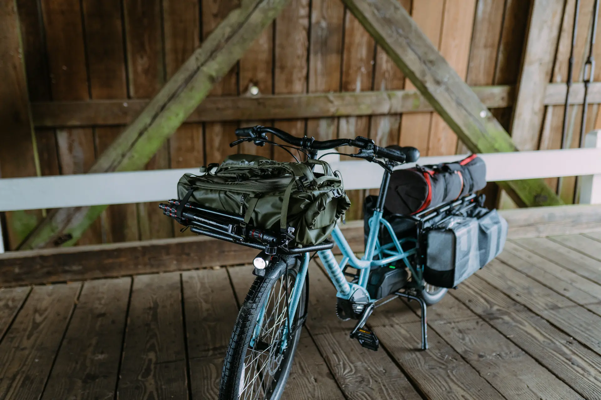 Xtracycle Swoop long-tail electric cargo bike carrying bags on the front and rear racks